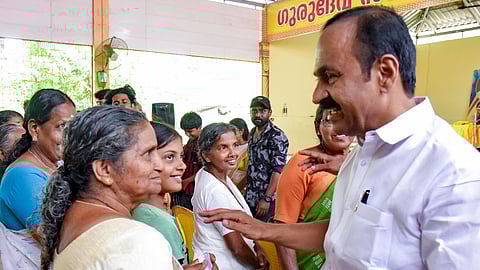 Leader of the Opposition and UDF candidate from Paravur constituency VD Satheesan interacts with residents during an election campaign, in Kochi, Sunday, March 22, 2026