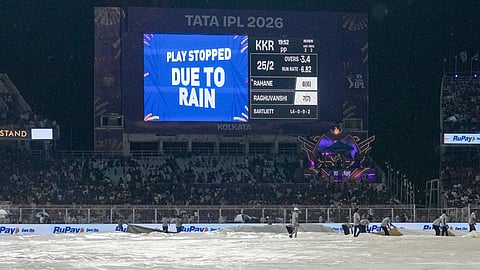 Ground staff cover the ground during rain interruption in an Indian Premier League (IPL) 2026 cricket match between Kolkata Knight Riders and Punjab Kings at Eden Gardens, in Kolkata, Monday, April 6, 2026