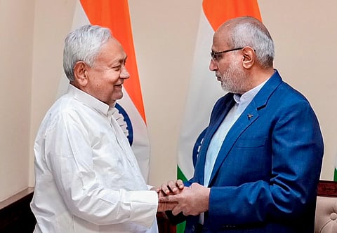 In this image posted on April 10, 2026, Vice President and Rajya Sabha Chairman CP Radhakrishnan greets Bihar Chief Minister Nitish Kumar as the latter takes oath as a member of the House during a ceremony at the former's chamber at the Parliament House complex, in New Delhi.