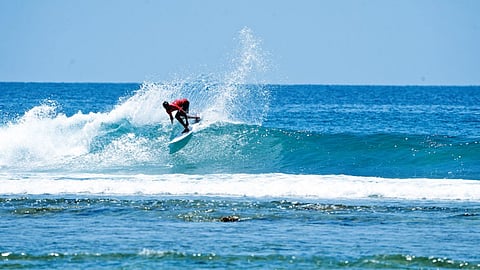 A surfer competing in the Little Andaman Pro 2026 event