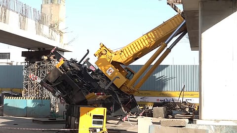 A crane overturns amid metro construction work causing a beam to fall, at Bandra Kurla Complex (BKC), in Mumbai, Maharashtra