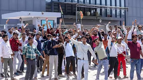 Factory workers during a protest demanding a hike in wages, in Noida