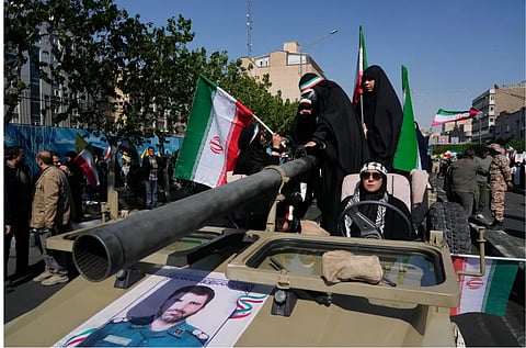 Women members of the Basij paramilitary, affiliated with Iran’s Revolutionary Guard, march with their weapons during a state-organized rally in support of the supreme leader marking National Girl’s Day in Tehran, Iran, Friday, April 17, 2026.