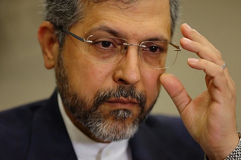 Iran’s Deputy Foreign Minister Saeed Khatibzadeh adjusts his glasses as he talks during an interview with Associated Press at the Antalya Diplomacy Forum, in Antalya, southern Turkey, Saturday, April 18, 2026. (AP Photo/Riza Ozel)