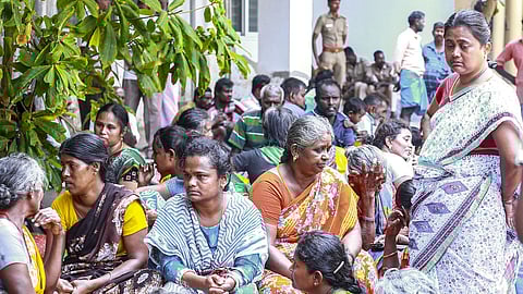 Family members and relatives gather outside a government hospital following the deaths of victims of a firecracker factory explosion, in Virudhunagar