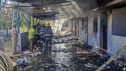 Firefighters at the site after a blast in a firecracker manufacturing unit, at Kattanarpatti in Virudhunagar, Tamil Nadu, Sunday, April 19, 2026.