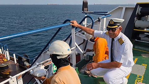 In this picture courtesy of Captain Rahman Al-Jubouri, right, supervises sailors on the deck of the Sea Moon oil tanker on the waters the Gulf of Oman