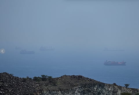 Tankers and bulk carriers anchored in the Strait of Hormuz, Saturday, April 18, 2026.