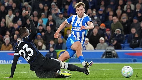 Brighton and Hove Albion's Jack Hinshelwood, right, scores their second goal during the Premier League soccer match between Brighton and Hove Albion and Chelsea,