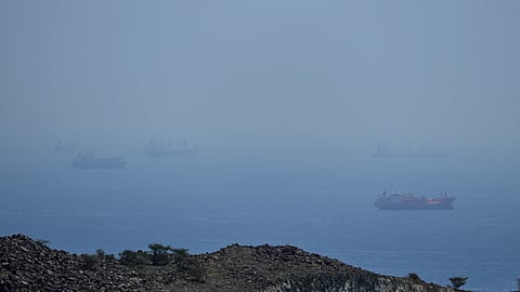 Tankers and bulk carriers anchored in the Strait of Hormuz, Saturday, April 18, 2026.