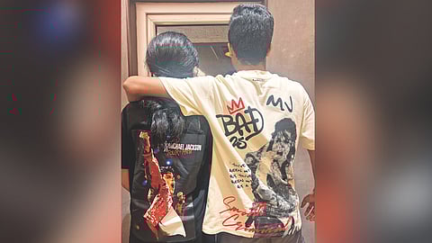 Fans dressed in Michael merchandise in theatres