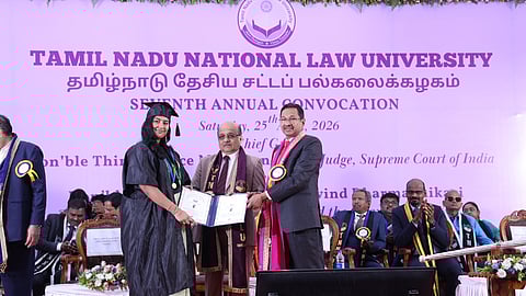 Chief Justice of the Madras High Court Justice Sushrut Arvind Dharmadhikari confers a degree on a student during the National Law University convocation in Tiruchy on Saturday