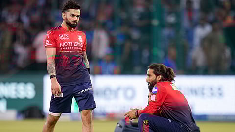 Royal Challengers Bengaluru's captain Rajat Patidar, right and Virat Kohli during a warm-up session before an Indian Premier League (IPL) T20 cricket match between Delhi Capitals and Royal Challengers Bengaluru, in New Delhi