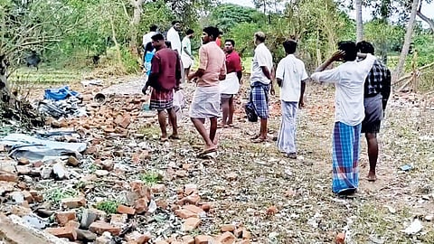 Raw materials and debris scattered near the collapsed unit at Kumbakonam on Saturday