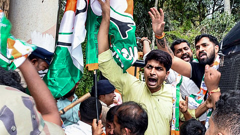 NSUI supporters stage a protest condemning the cancellation of the NEET examination following the alleged question paper leak, in Chikkamagaluru, Wednesday, May 13, 2026
