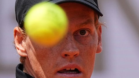 Italy's Jannik Sinner eyes the ball as he plays Andrey Rublev.