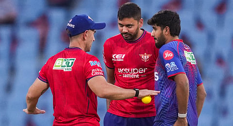 Lucknow Super Giants' head coach Justin Langer, left, interacts with Avesh Khan, centre, and Yash Thakur during warm-up before an Indian Premier League (IPL) 2026 T20 cricket match between Lucknow Super Giants and Punjab Kings, in Lucknow, Uttar Pradesh, Saturday, May 23, 2026
