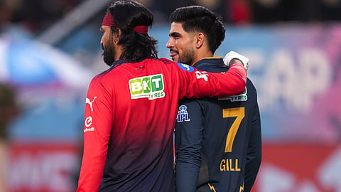 Gujarat Titans' captain Shubman Gill, right, with Royal Challengers Bengaluru's Krunal Pandya during a warm-up before the Indian Premier League (IPL) 2026 T20 first qualifier cricket match between Royal Challengers Bengaluru and Gujarat Titans