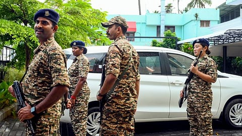 Security personnel stand guard outside the residence of former Kerala Chief Minister Pinarayi Vijayan after the Enforcement Directorate (ED) conducted a raid at Vijayan's residence as part of its investigation against his daughter in the CMRL money laundering case, in Thiruvananthapuram