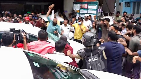 LDF activists attack the vehicle carrying Enforcement Directorate (ED) officials after ED conducted a raid at former Kerala Chief Minister Pinarayi Vijayan's residence as part of its investigation in the CMRL money laundering case