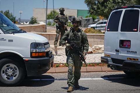 Israeli security forces are deployed at the scene of a shooting attack carried out by a Palestinian citizen of Israel near Tzur Yitzhak in central Israel, Sunday, June 7, 2026.