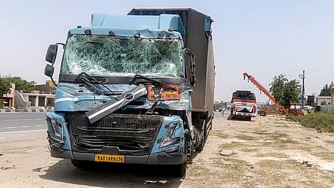 Damaged remains of a truck after it collided with a passenger bus on the Agra-Delhi Highway, in Mathura