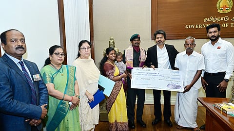 CM Vijay presenting the check to Lance Naik A Meenatchi Sundaram at the Secretariat, cash incentive of Rs 48 lakh.