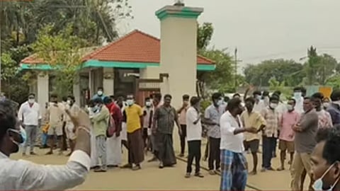 People gathered outside the factory