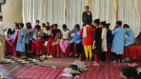 Women survivors sheltered at a private marriage hall in Periyapalayam are provided medical support