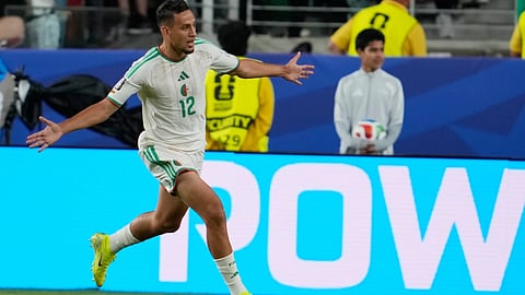 Algeria's Nadhir Benbouali (12) celebrates after scoring a goal during the World Cup Group J soccer match between Jordan and Algeria in Santa Clara