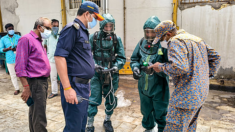 National Disaster Response Force (NDRF) personnel arrive at a seafood export unit following an ammonia gas leak, in Manjangaranai, Tiruvallur