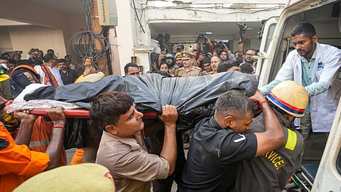 Rescue personnel conduct rescue operations after fire broke out at a commercial building in Aliganj, Lucknow, Uttar Pradesh, Monday, June 22, 2026. Students were killed after a massive fire blazed through a three-floor commercial building in a residential area