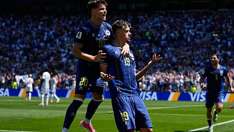 Bosnia's Kerim Alajbegovic, right, celebrates with Esmir Bajraktarevic after scoring his side's opening goal during the World Cup Group B soccer match against Qatar in Seattle