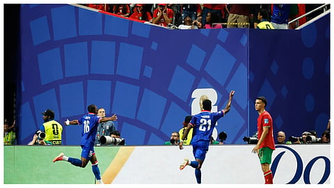 Haiti's Lenny Joseph (16) celebrates after Morocco goalkeeper Yassine Bounou scored an own goal during the World Cup Group C soccer match between Morocco and Haiti in Atlanta.