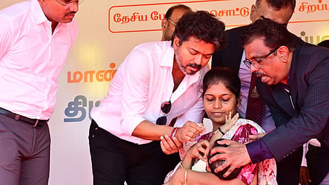 CM Vijay gives polio drops to a baby