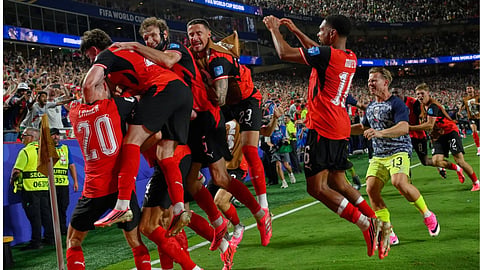 Austria's players celebrates after Austria's Sasa Kalajdzic (14) scored to tie the match during the World Cup Group J soccer match between Algeria and Austria in Kansas City, Mo.
