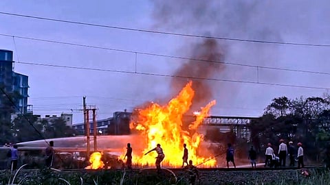 Dark smoke and flames billow after a massive fire broke out suddenly in naphtha-carrying pipeline at the Haldia Refinery