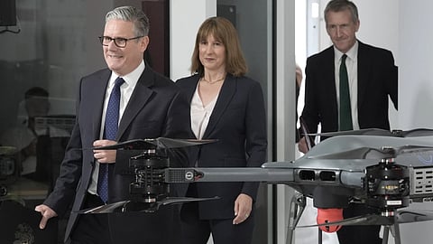 Prime Minister Keir Starmer, left, followed by Chancellor of the Exchequer Rachel Reeves and Defense Secretary Dan Jarvis arrive for the announcement of a defense plan, in Berkshire, England