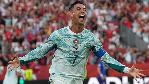 Portugal's Cristiano Ronaldo (7) celebrates after scoring their opening goal during the World Cup round of 32 soccer match between Portugal and Croatia in Toronto