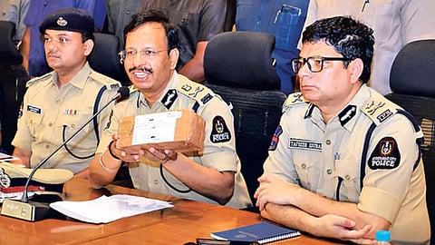 Hyderabad Police Commissioner VC Sajjanar displays the parcel came in the courier