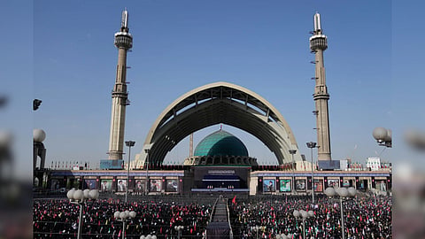 The coffins of the late Iranian Supreme Leader Ayatollah Ali Khamenei and members of his family are displayed on a stand at the start of the dayslong funeral ceremonies at the Imam Khomeini Mosalla Grand Mosque in Tehran, Iran.