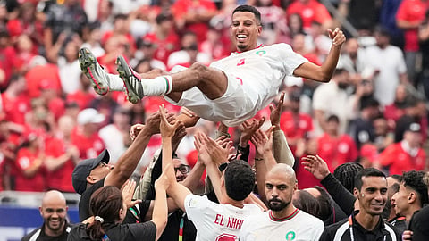 Morocco's Azzedine Ounahi is thrown in the air by his teammates after the World Cup round of 16 soccer match against Canada in Houston