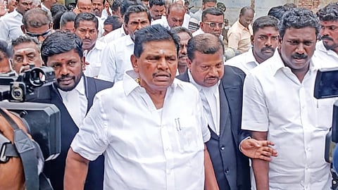 DMK MLA Anitha Radhakrishnan with supporters after appearing before a court in Tiruchendur on Saturday