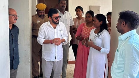Minister Sreenath interacting with students from the hostel to obtain feedback on its facilities.