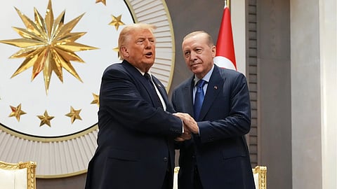 President Donald Trump shakes hands with Turkish President Recep Tayyip Erdogan upon arriving for the NATO summit in Ankara, Turkey.