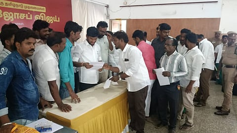 Minister S Ramesh receives petitions from residents of the Srirangam constituency during a grievance redressal meeting in Tiruchy on Tuesday