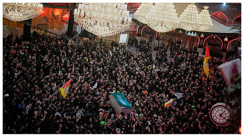 The coffin of the late Iranian Supreme Leader Ayatollah Ali Khamenei is carried through a crowd of mourners at the Imam Hussein Shrine in Karbala, Iraq, early Thursday, July 9, 2026