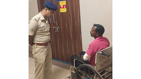 The District SP questioning the policeman