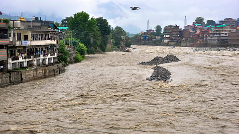 A view of the swollen Beas river after its water level rose following heavy rainfall, in Kullu