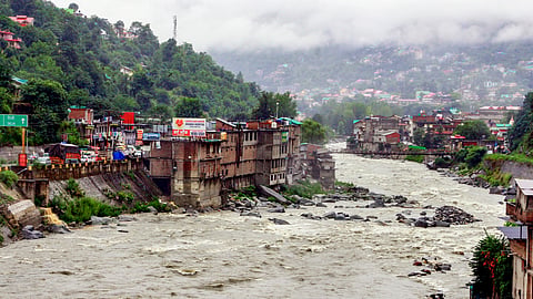 A view of the swollen Beas river after its water level rose following heavy rainfall, in Kullu, Himachal Pradesh